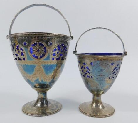 A graduated pair of George III silver sugar baskets