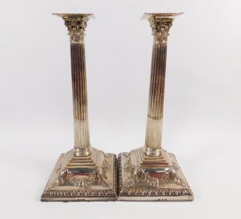 A pair of George III silver candlesticks