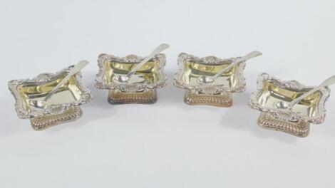 A set of four George III silver and silver gilt open salts