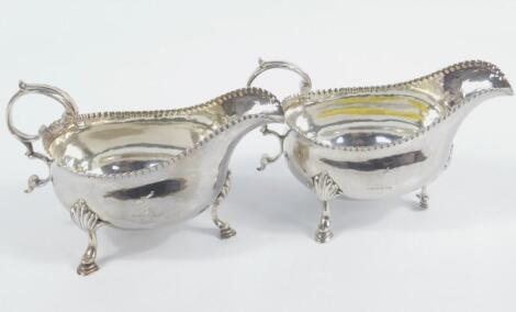 A pair of George III silver sauce boats