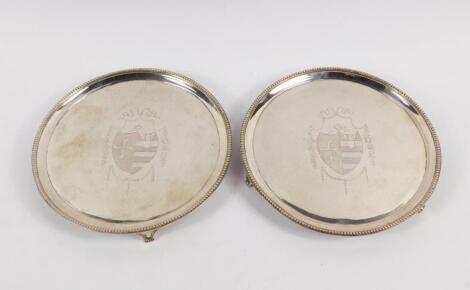 A pair of George III silver waiters