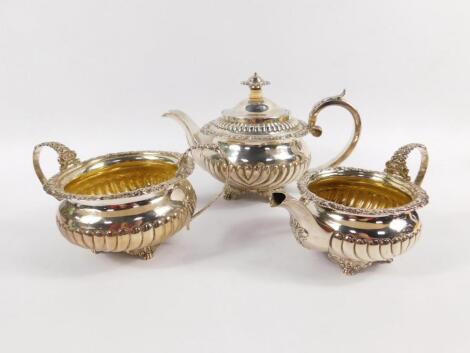 A George III silver and silver gilt three piece tea service