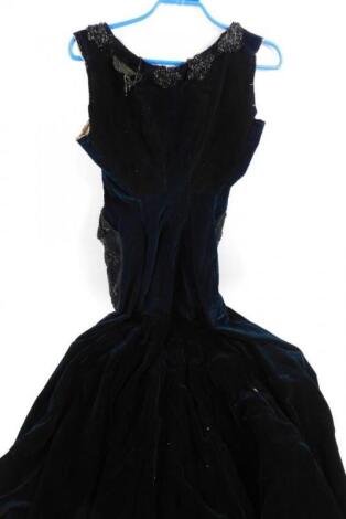 An early 19thC blue velvet bodice dress with black lace and bead work trim.