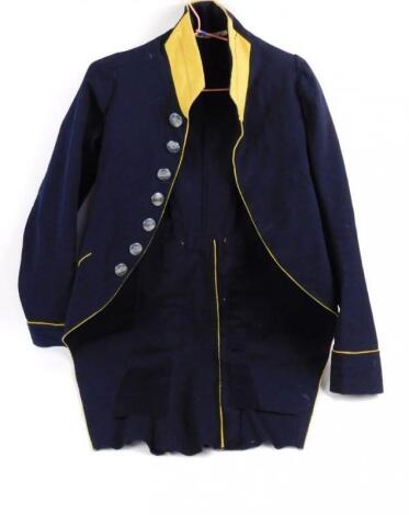 A 19thC livery tail coat with crested buttons and yellow trim.