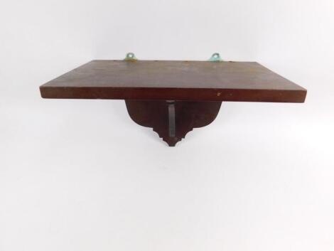 A mahogany wall bracket