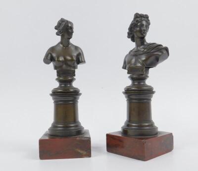 A pair of 20thC bronze busts