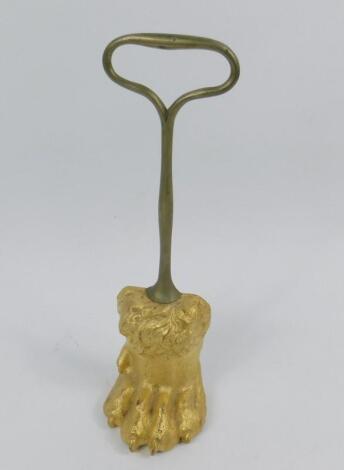 A 19thC gilt cast iron door porter