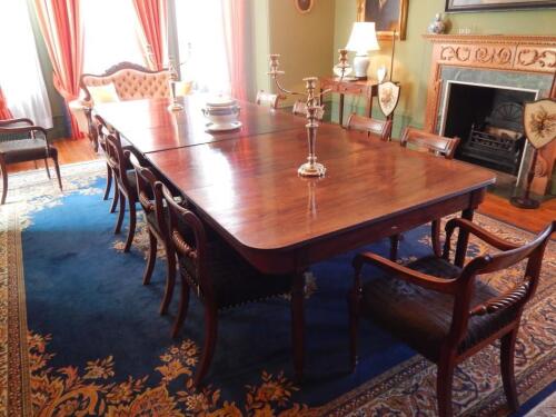 A George III mahogany extending dining table