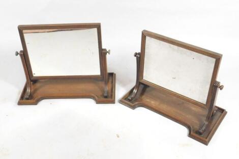 A pair of early Victorian mahogany swing framed dressing table mirrors