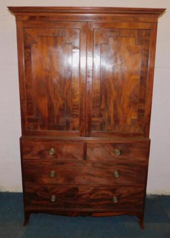 An early 19thC mahogany clothes press