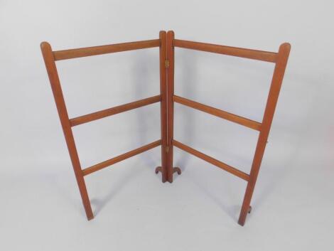 An Edwardian mahogany folding towel rail