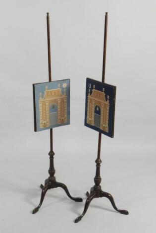 A pair of 19thC mahogany pole screens