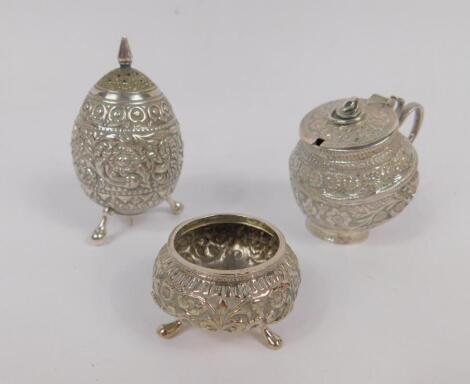 An Indian early 20thC three piece cruet set