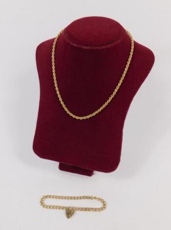 A 9ct gold rope twist neck chain and a 9ct gold cur link bracelet