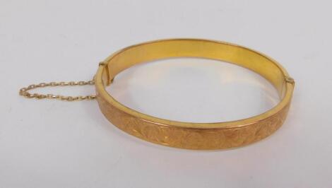 A 9ct gold bangle