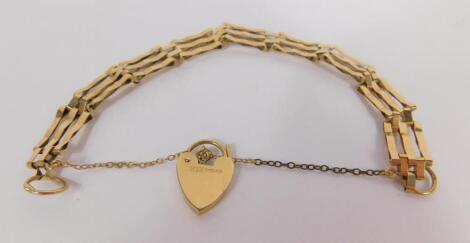 A 9ct gold three bar gate bracelet