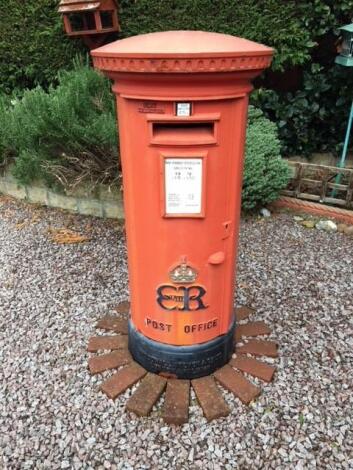 A red cast iron Edward VIII Post Office post box of pillar form.