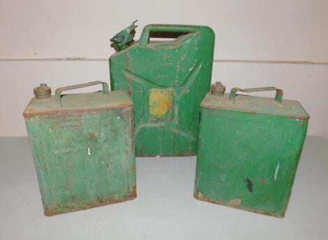 A 1946 BMP petrol can and two green metal petroleum cans.