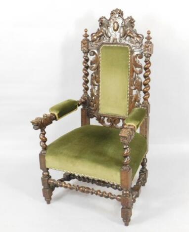 A Victorian Carolean style carved oak carver chair