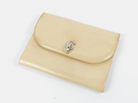 A Christian Dior cream leather clutch bag