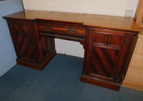 A Victorian oak break front sideboard