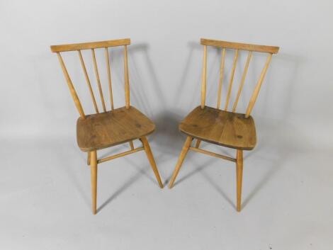 A pair of Ercol 1960's oak and elm 391 kitchen chairs.