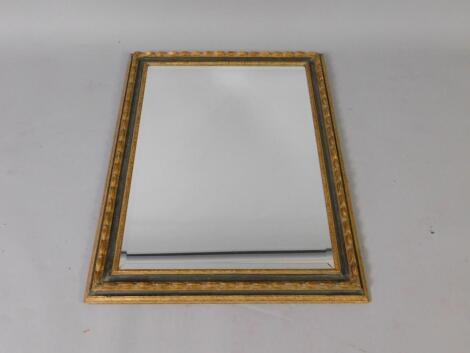 A gilt and stained wood rectangular wall mirror