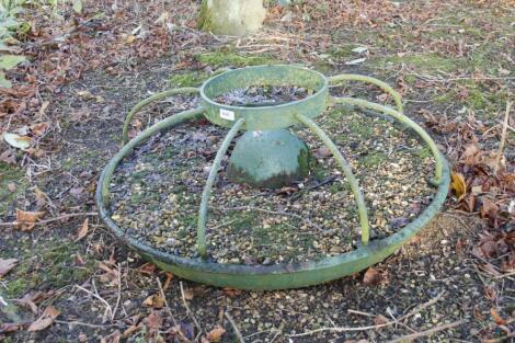 A cast iron Mexican hat animal feeder.