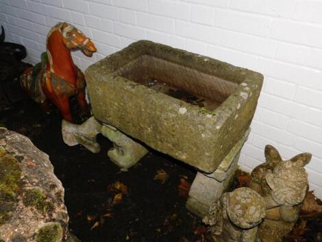 A rectangular stone trough