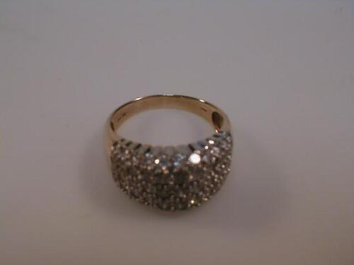 A wide band pav£ set diamond ring