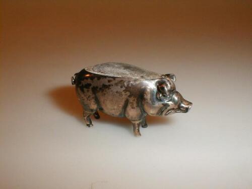 An Edwardian silver pig pin cushion