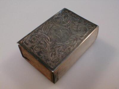 A silver matchbox cover