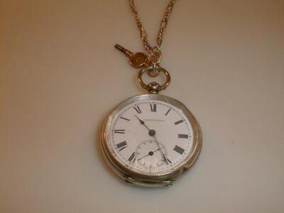 A silver open face pocket watch