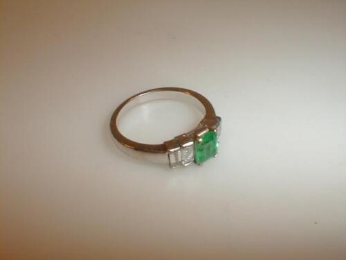 A diamond and emerald five stone ring