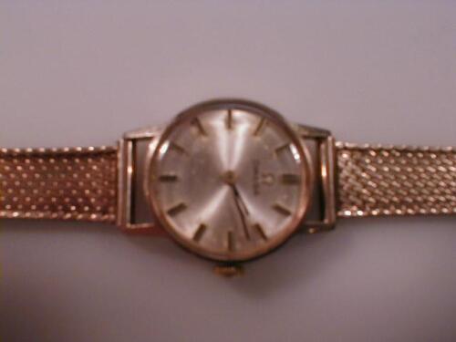 A ladies 9ct gold Omega wristwatch on fine mesh link bracelet