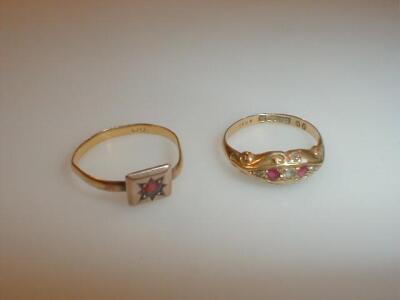 A Victorian gypsy style ring set with three tiny diamonds and two pink