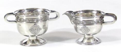 A George V silver Dublin Arts & Crafts sugar bowl and milk jug