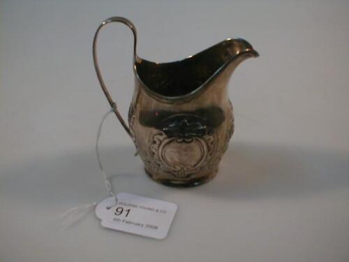 A George III silver helmet cream jug