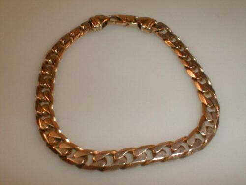 A gents curb link bracelet marked for 9ct