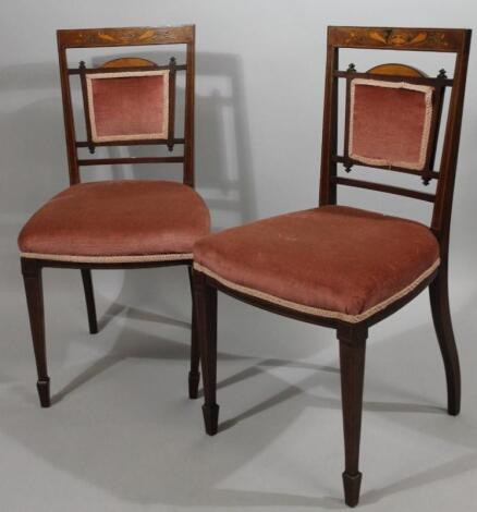 A pair of Edwardian mahogany and boxwood strung hall chairs