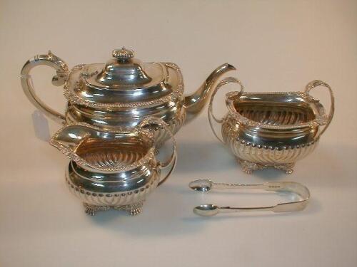 An Edwardian silver three piece tea service by Edward Barnard & Sons Ltd;