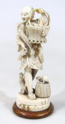 A Japanese Taisho period ivory figure of a gentleman