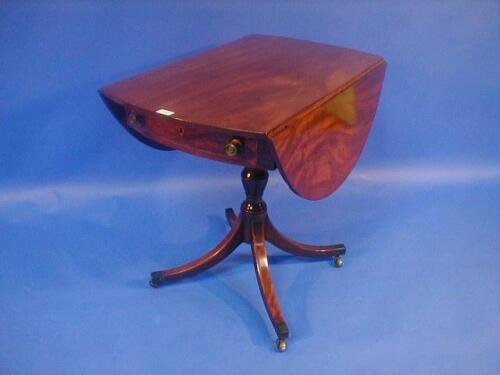 A 19thC mahogany Pembroke table with oval top with bow frieze drawer