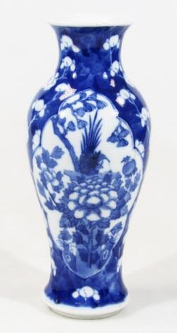 A Chinese porcelain blue and white prunus vase