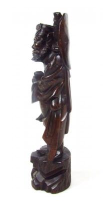 An ebonised carved hardwood figure - 2