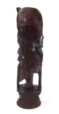 An ebonised carved hardwood figure - 3