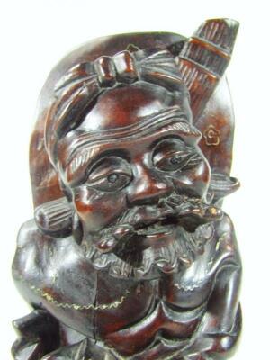 An ebonised carved hardwood figure - 6