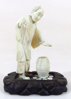 A Taisho period Japanese ivory figure group