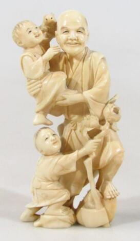 A Japanese late Meiji period ivory figure group