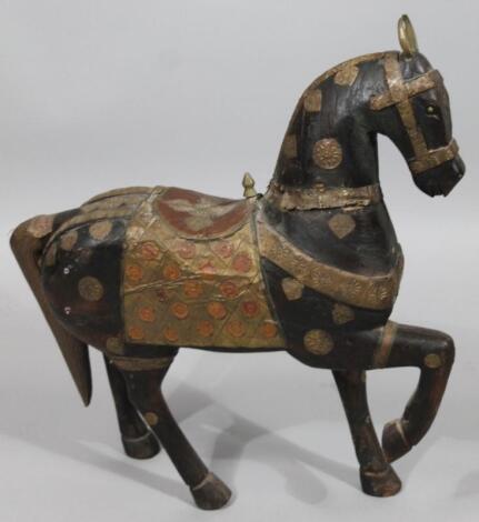 An Arabian carved wooden figure of a horse